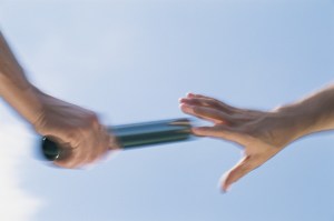 Hand Passing Baton, Motion Blur