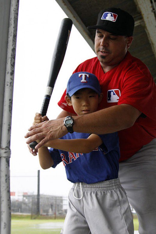Teaching a boy to bat