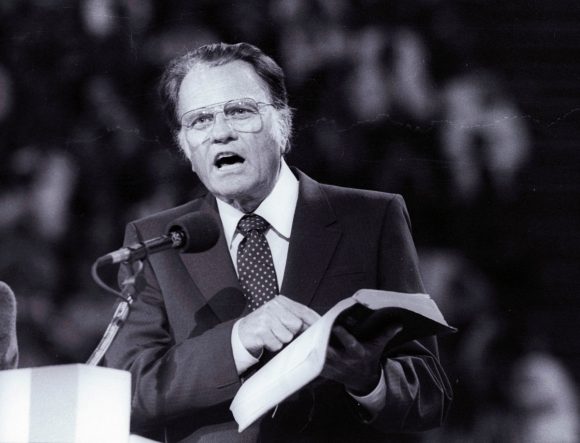 FILE PHOTO: Evangelist Graham, preaches the Gospel to thousands of believers during the meeting at Bercy's Stadium in Paris as part of a worldwide crusade