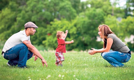 Family Playing Together Outside During Summer