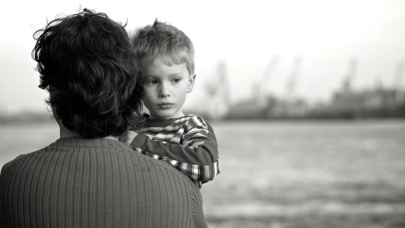 Father carrying his child